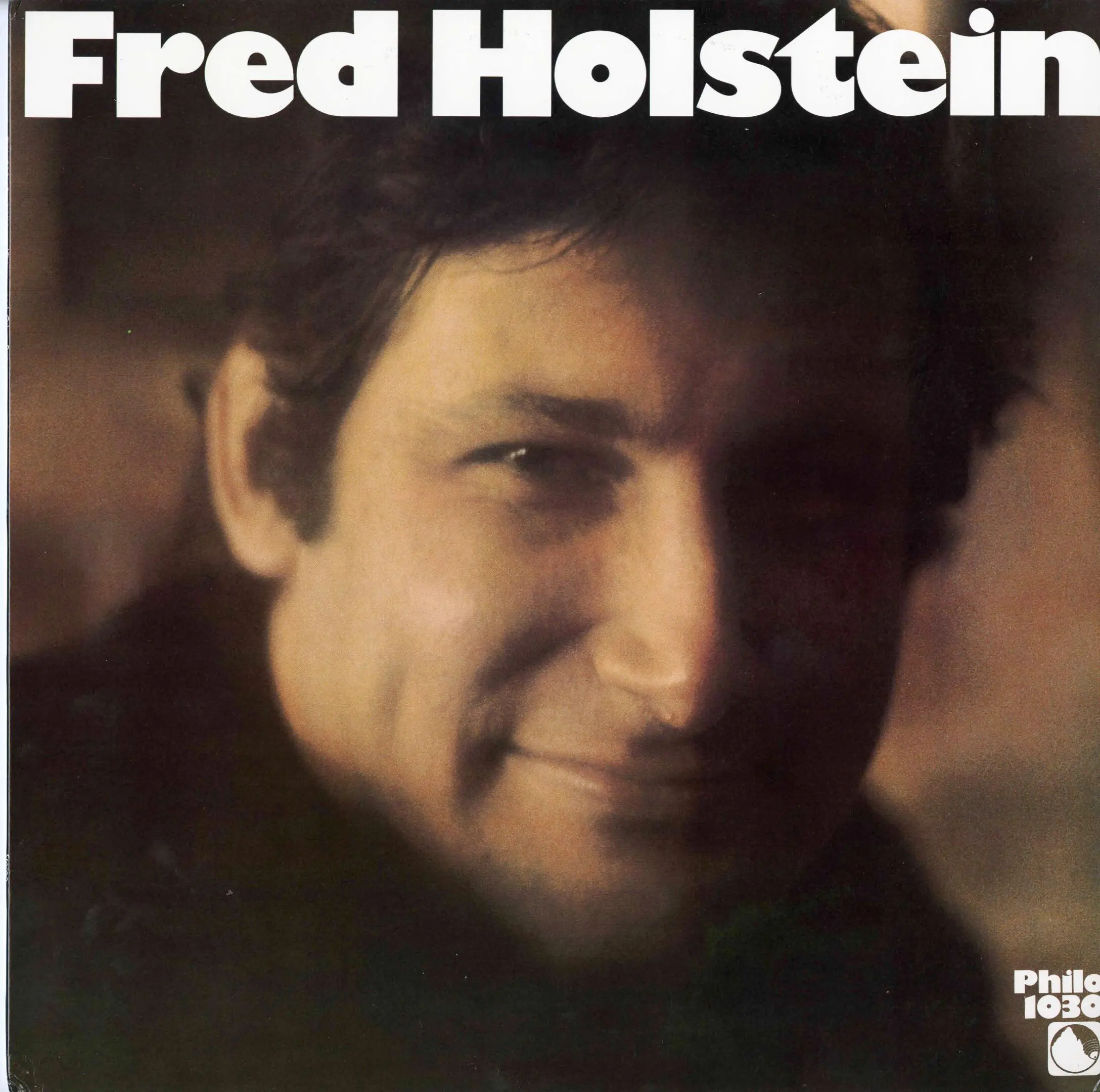 Album cover with a man's portrait.