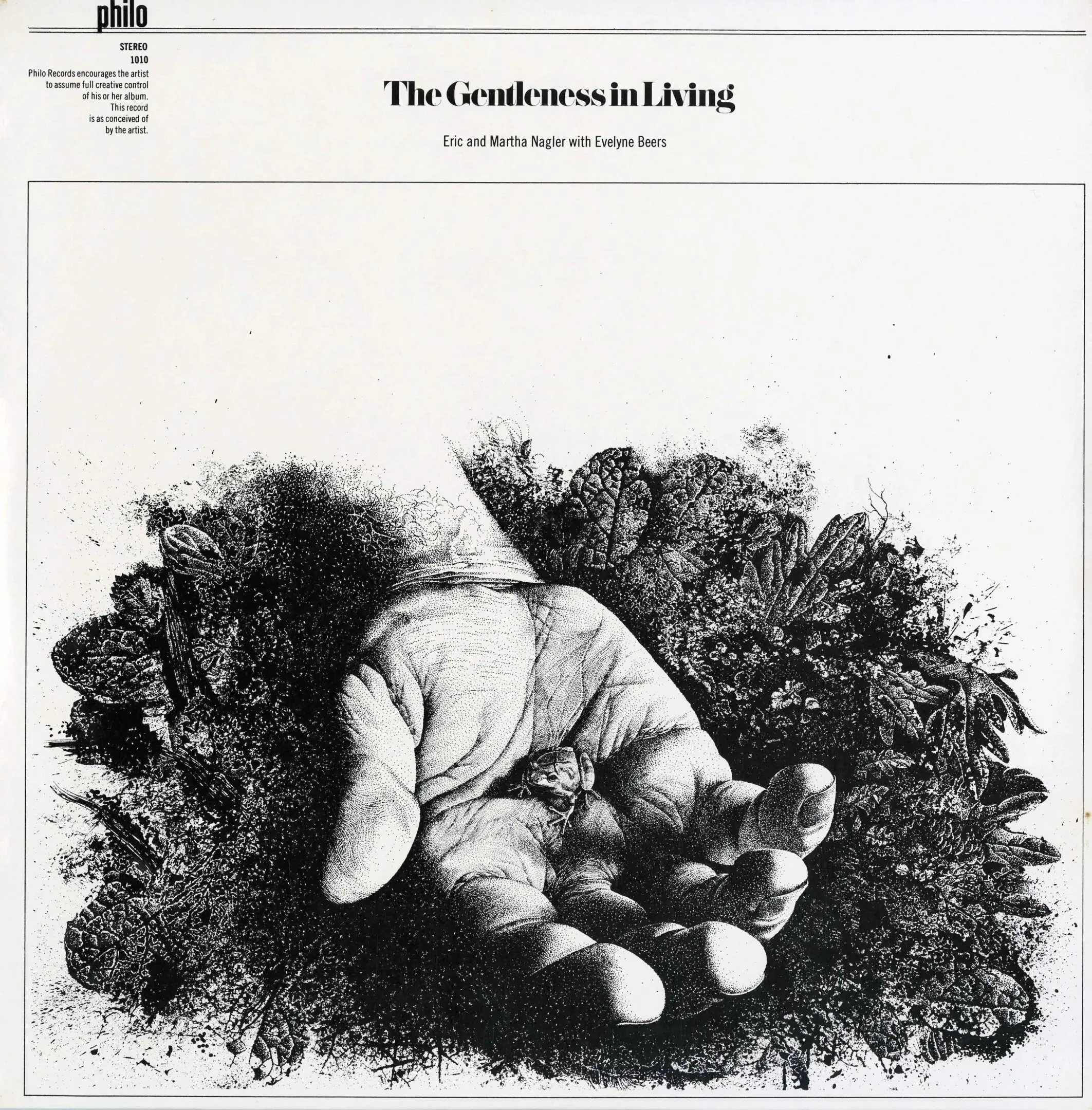 Hand holding small object among foliage.
