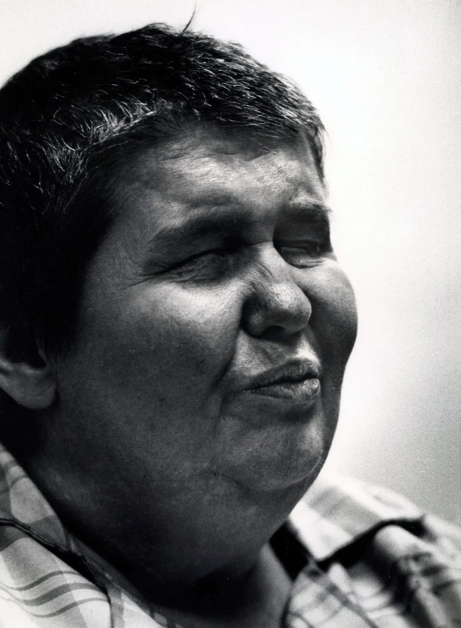 Person with closed eyes, making a face.