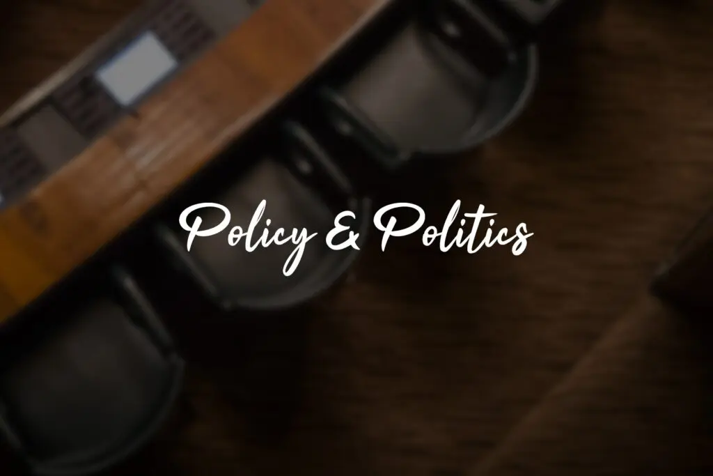 Policy & Politics" text on blurred background.