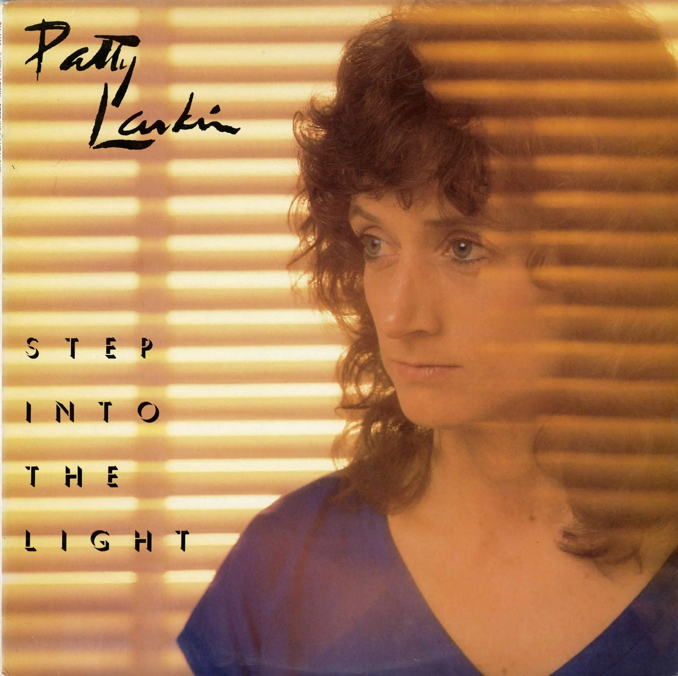 Woman behind blinds, "Step Into the Light".