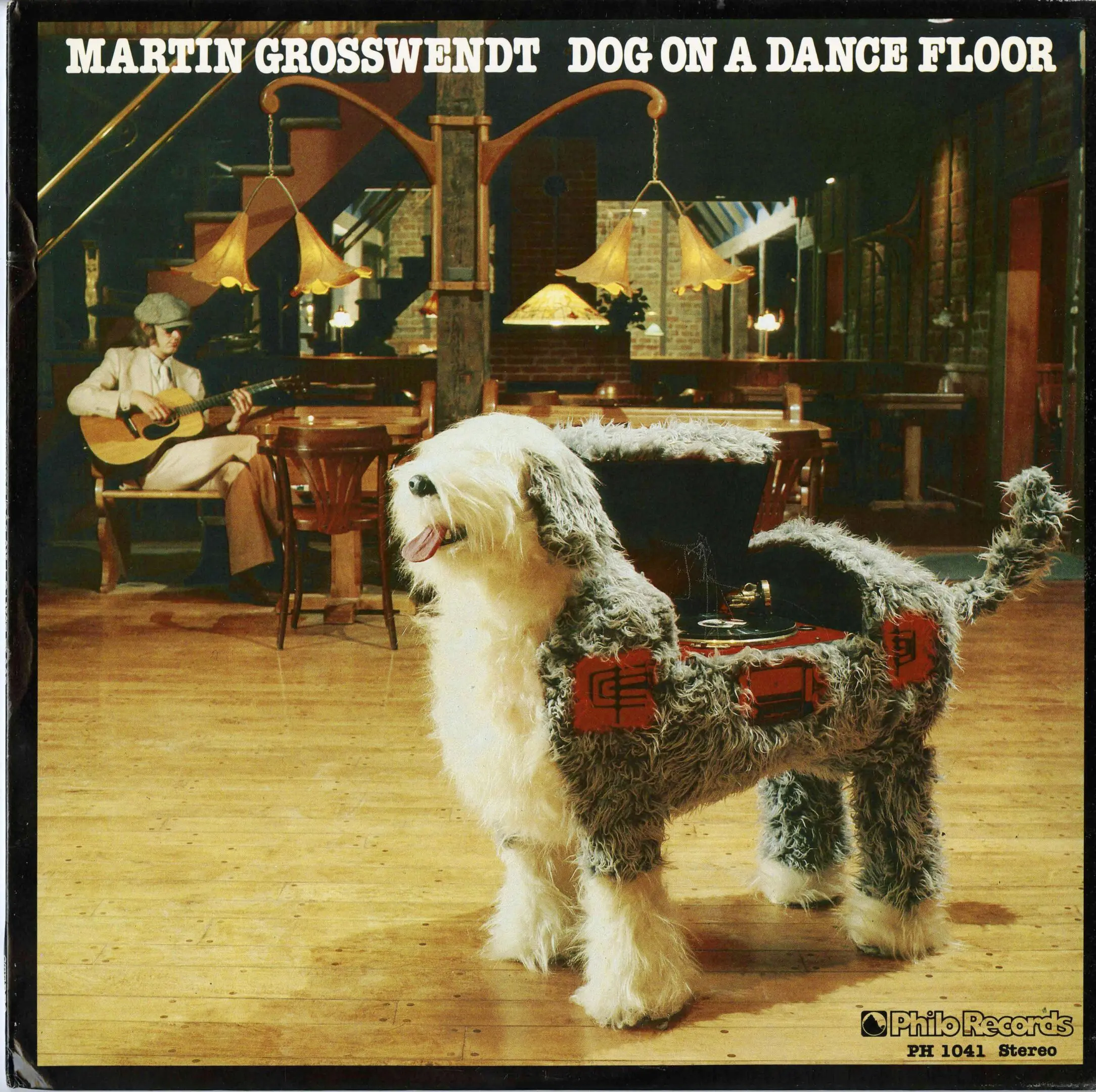 Dog-shaped jukebox on a dance floor.