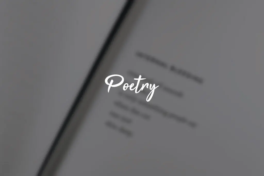 Blurry book page with "Poetry" text overlay.