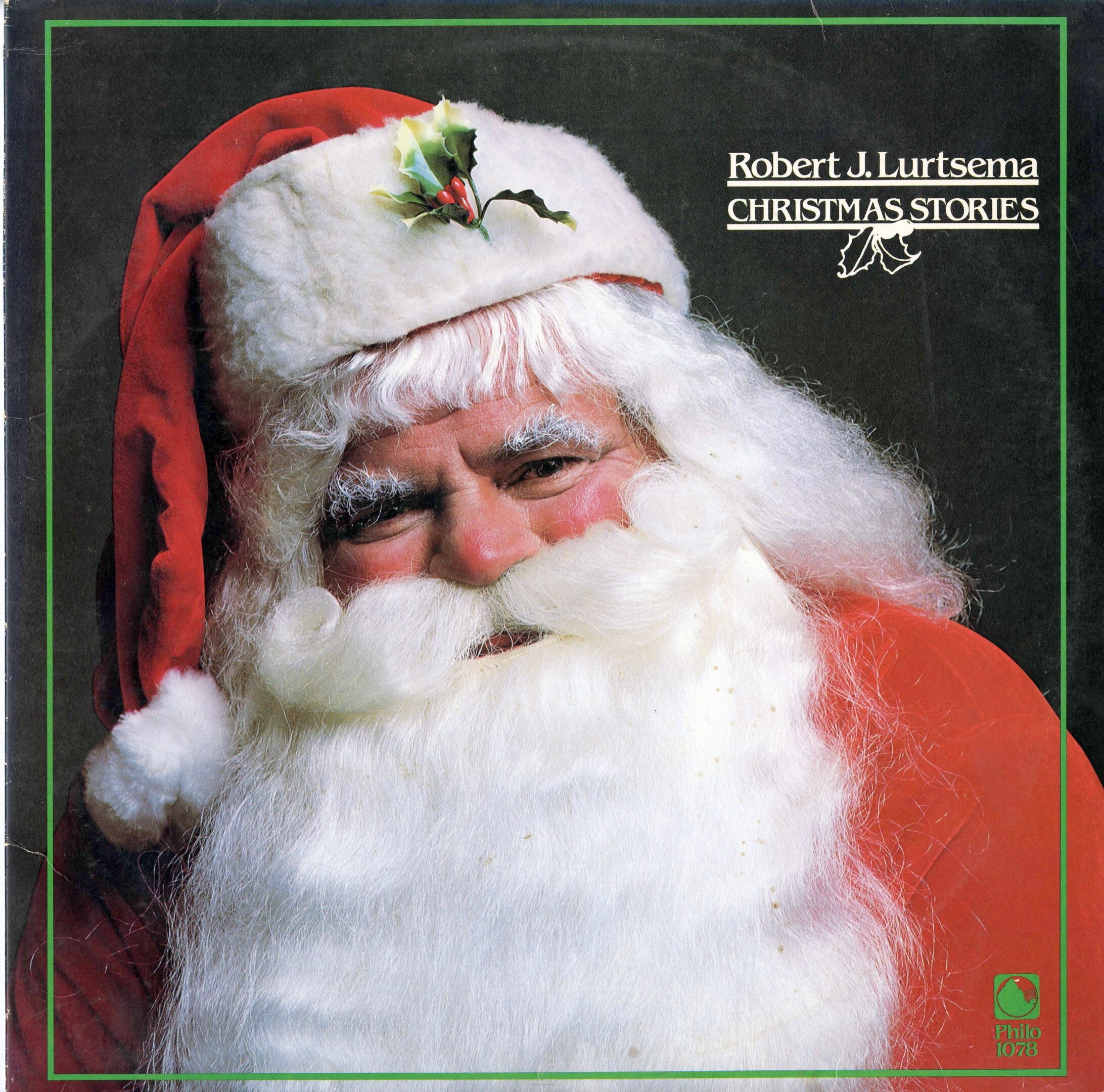 Santa Claus wearing a red hat smiling.