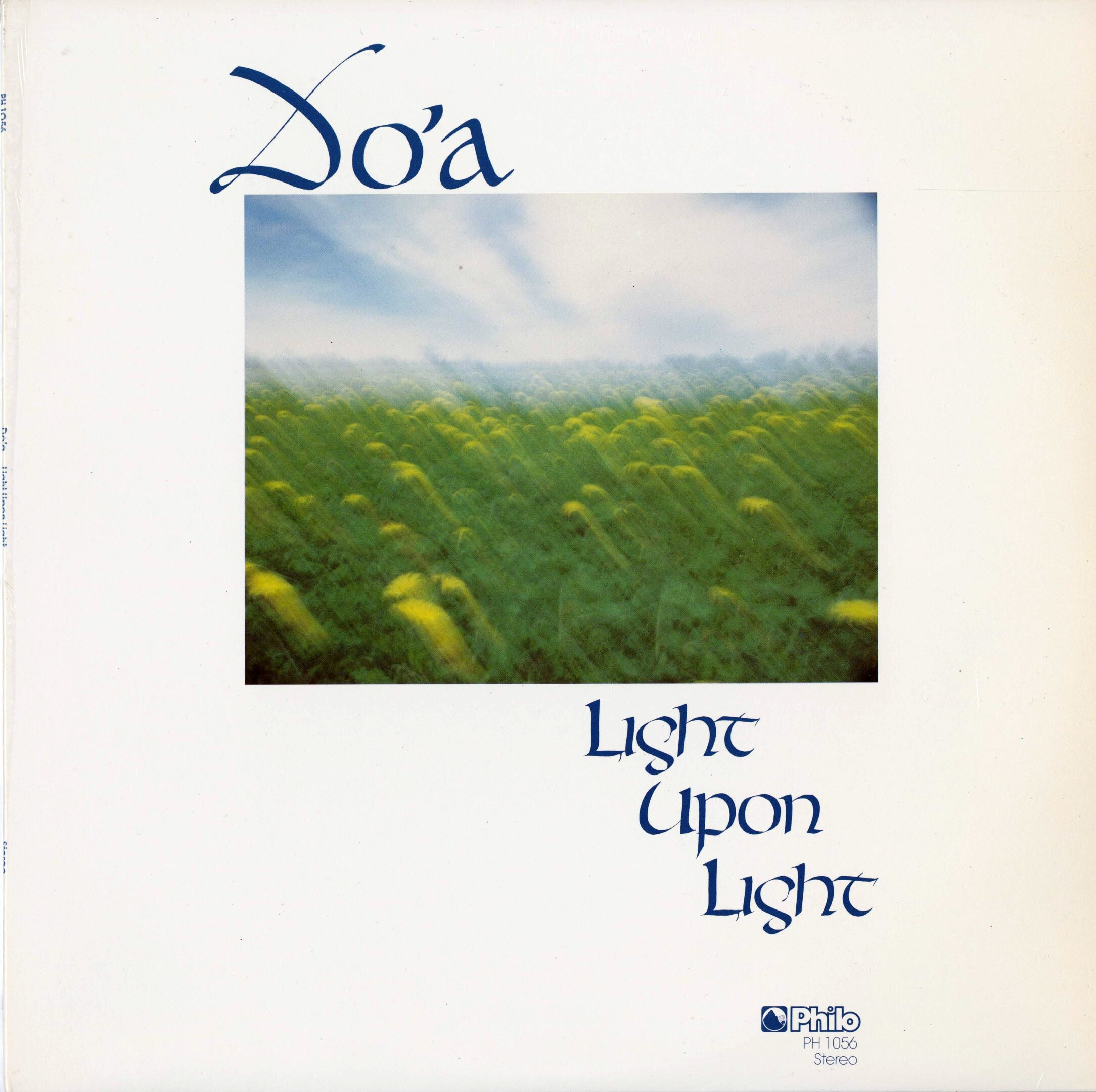 Album cover with blurred field and sky.