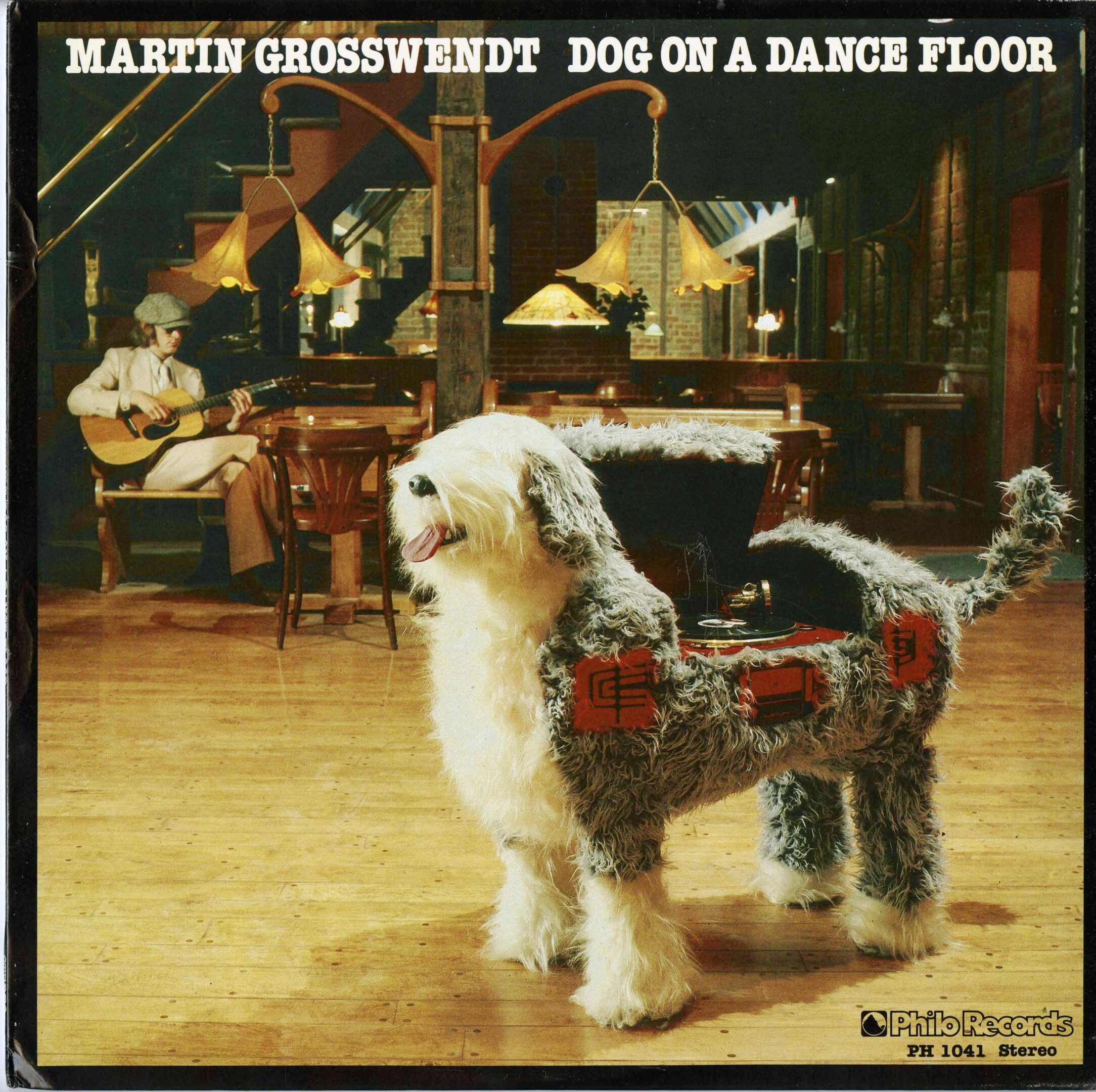Dog-shaped jukebox on a dance floor.