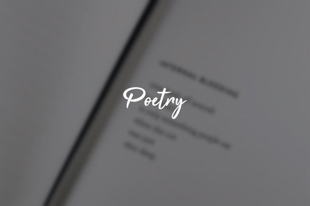 Blurry book page with "Poetry" text overlay.