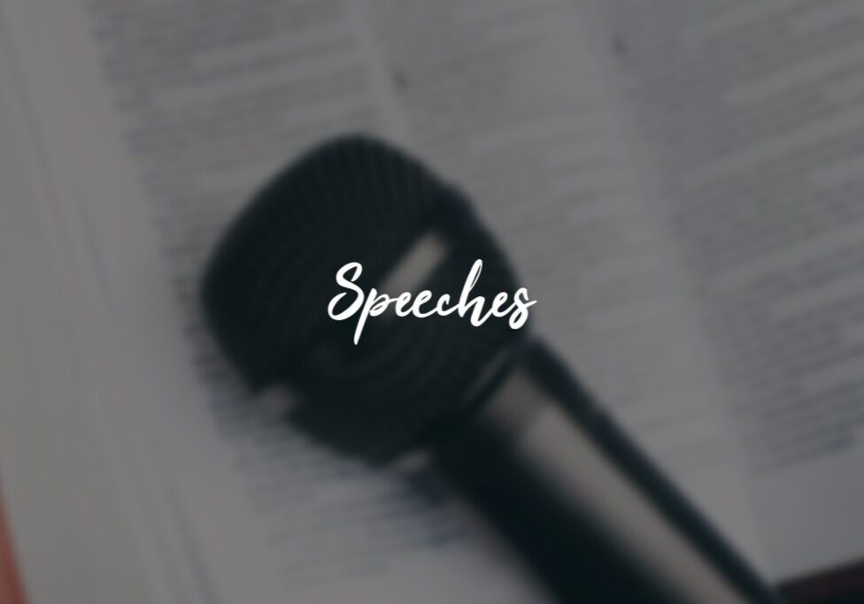 Microphone on book with "Speeches" text overlay. Microphone on book with "Speeches" text overlay.