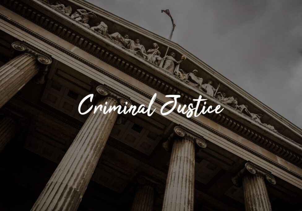 Stone columns with "Criminal Justice" text overlay. Stone columns with "Criminal Justice" text overlay.