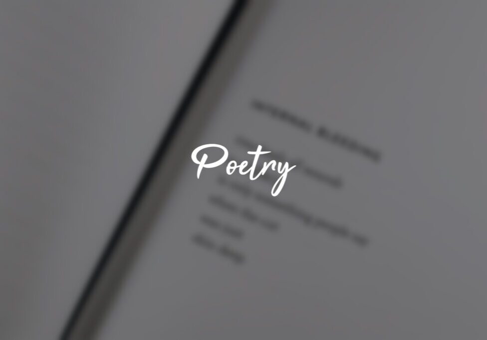 Blurry book page with "Poetry" text overlay. Blurry book page with "Poetry" text overlay.
